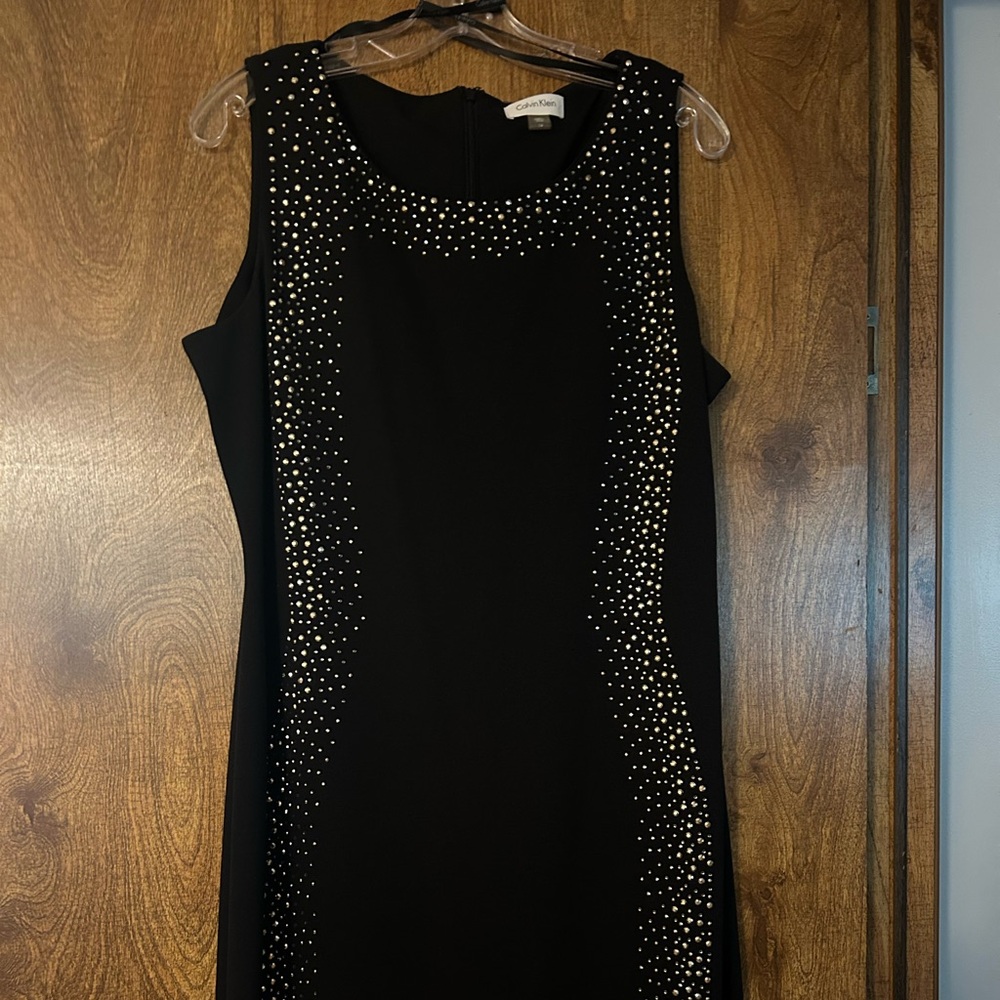 Black sleeveless with gold studs never worn